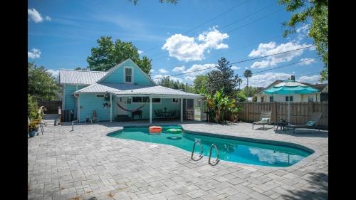 a house with a swimming pool in a yard at Family Home with Private Pool Yard Only 24 Mi to Disney in Saint Cloud