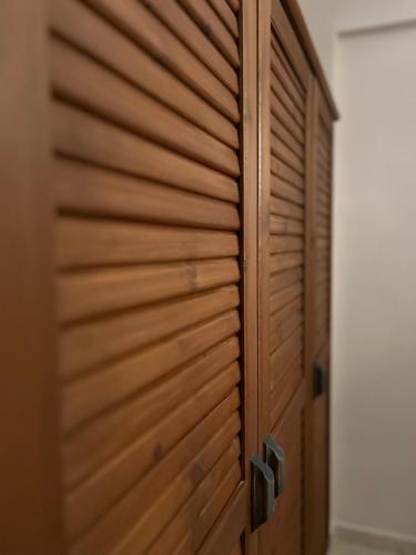 a wooden closet with a wooden door in a room at Luxury Heaven farm one in Kastoria