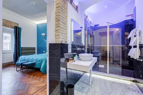 a bathroom with a shower and a sink in a room at Navona Queen Rooftop in Rome