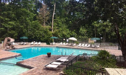 a large swimming pool with chairs and a slide at Heavenly View 2308 in Gatlinburg