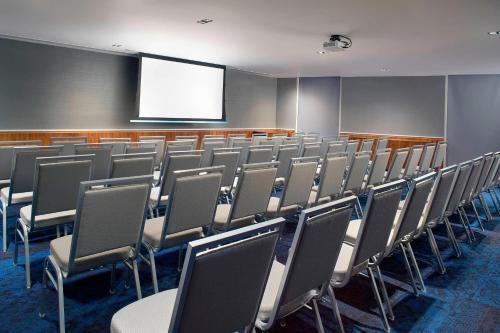 a lecture room with a bunch of chairs and a screen at Courtyard by Marriott Mexico City Toreo in Mexico City