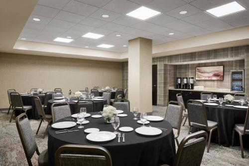a conference room with tables and chairs and tablesktop at Courtyard by Marriott Newark Downtown in Newark