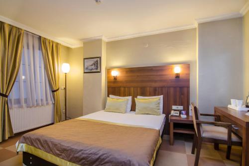 Katil atau katil-katil dalam bilik di Grand Gebze Hotel