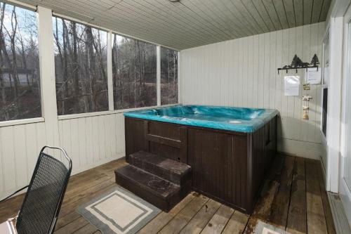 a jacuzzi tub in a room with a window at Mountain Therapy 1123 in Gatlinburg