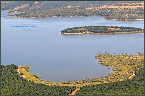 an aerial view of a large body of water at Camping Urbion in Abejar
