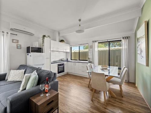a living room with a couch and a table at Tootys Place in Margaret River Town
