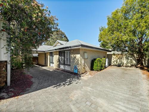 a house with a driveway in front of it at Tootys Place in Margaret River Town
