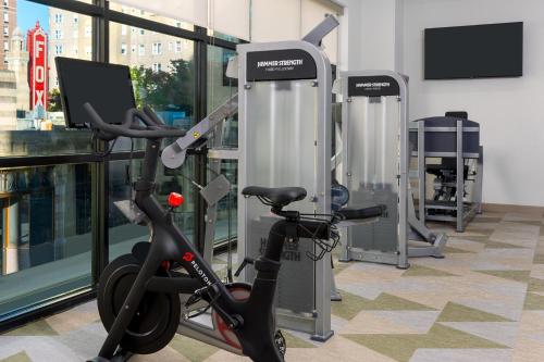 a gym with an exercise bike in a building at Courtyard by Marriott Atlanta Midtown in Atlanta
