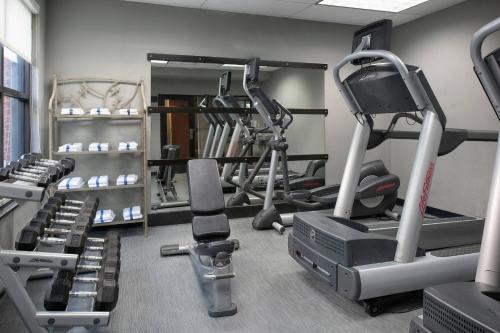 a gym with several treadmills and cardio machines at Courtyard Memphis Collierville in Collierville