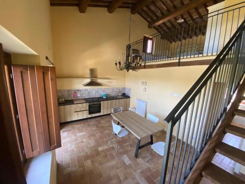 an overhead view of a kitchen with a table and chairs at Agriturismo Sant'Angelo holiday farm in Gualdo Cattaneo