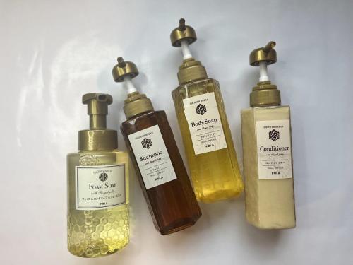 a group of four bottles of liquid soap at Hotel Route Inn Grand Asahikawa Ekimae in Asahikawa