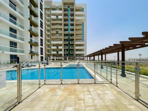 a swimming pool in the middle of a building at Lovely Studio & Budget Friendly in Dubai