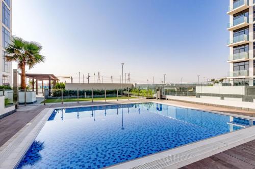 a large swimming pool on top of a building at GLOBALSTAY Azizi Riviera 48 in Dubai