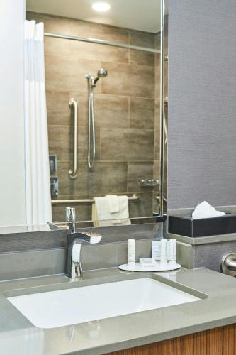 a bathroom with a sink and a shower at Courtyard Medford Airport in Medford