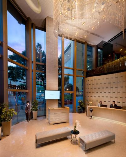 a lobby of a building with a chandelier at Dorsett Mongkok, Hong Kong in Hong Kong