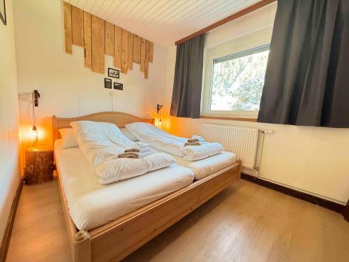 Mallnbach Apartmentsにあるベッド