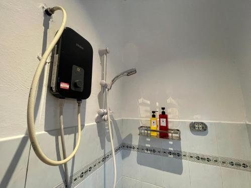 a shower in a bathroom with a hose at BBQ Swimming Pool Netflix 11 Pax Bukit Indah JB in Johor Bahru