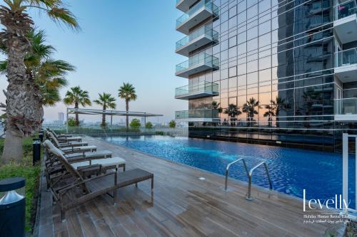 an image of a swimming pool at a building at Luxury Studio in DAMAC Hills with Premium Amenities in Dubai