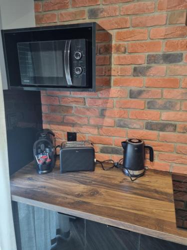 Apartament Gardenにあるコーヒーまたはお茶