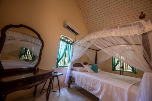 Postel nebo postele na pokoji v ubytování Cadjan Sacred Anuradhapura