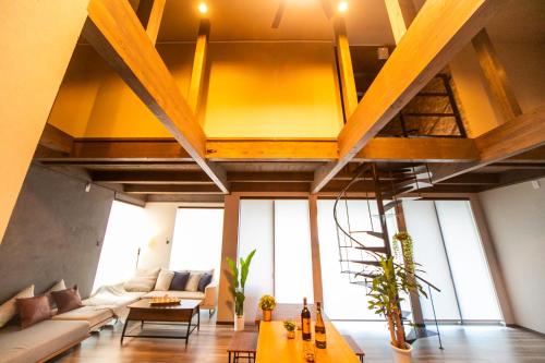 a living room with a couch and a table at Awaji Ocean View in Kusaka in Awaji