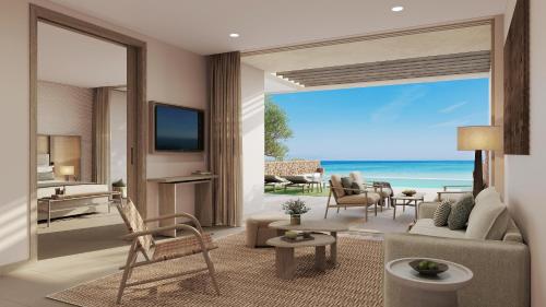 a living room with a view of the ocean at Sani Club in Sani Beach