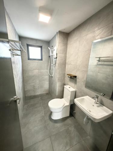 a bathroom with a toilet and a sink and a shower at UCSI Residence 2 By UCSI Hotels in Kuala Lumpur