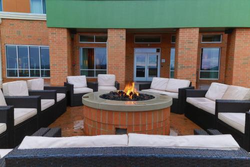 a patio with a fire pit in the middle of a building at Courtyard by Marriott Morgantown in Morgantown
