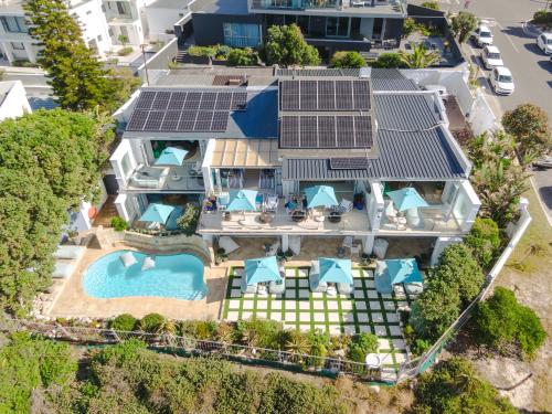 an aerial view of a house with solar panels on it at Last Word Long Beach in Kommetjie