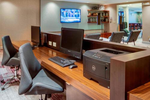 an office with a desk with a computer and a printer at Courtyard by Marriot Cranbury South Brunswick in Cranbury