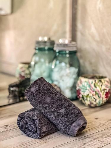 a sock sitting on a table next to glass jars at Escape to a Mountain Retreat in Beechmont, Australia in Beechmont
