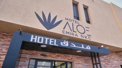 a hotel akron amelia mg sign on a building at Hotel Aloe Emira NKC in Nouakchott