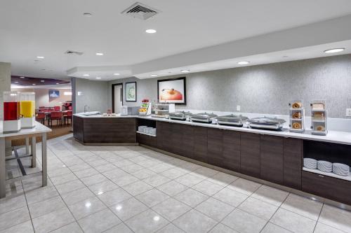 a fast food restaurant with a counter with food at Courtyard Boston Marlborough in Marlborough