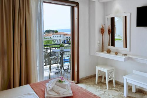 a hotel room with a view of a balcony at Hotel Korali in Troulos