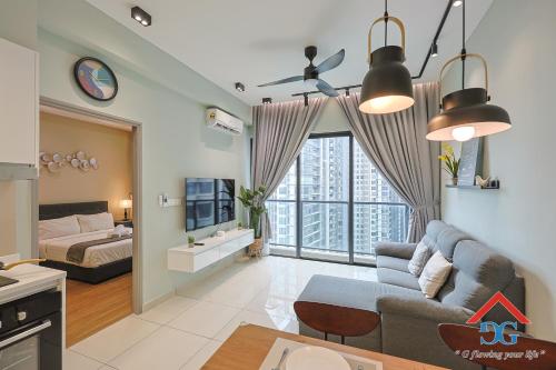 a living room with a couch and a bed at Astoria Ampang By Grabstay in Kuala Lumpur