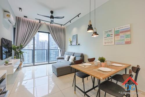 a living room with a table and a couch at Astoria Ampang By Grabstay in Kuala Lumpur