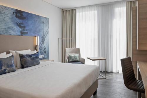 Postel nebo postele na pokoji v ubytování Courtyard by Marriott Munich Garching