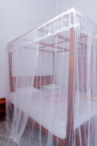 Postel nebo postele na pokoji v ubytování Golden Surfer Beach Hotel