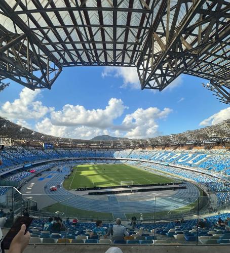 a view of a soccer stadium with a match at Smart Station Hotel in Naples