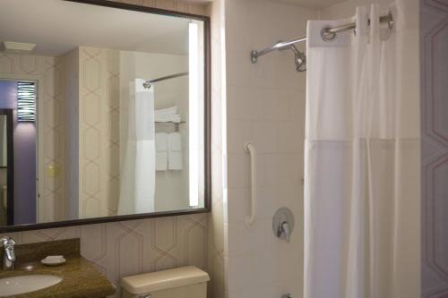 a bathroom with a shower and a toilet and a sink at Courtyard by Marriott New York Manhattan/ Fifth Avenue in New York