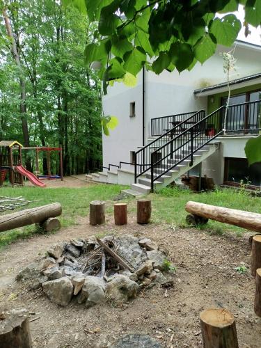 a fire pit in the yard of a house at Penzión NADKA in Bojnice