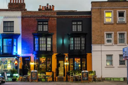 a building with tables and chairs in front of it at Becketts Townhouse in Portsmouth