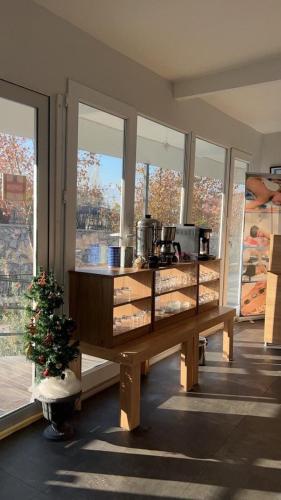 a kitchen with a counter in a room with windows at Akapella in Pamukkale