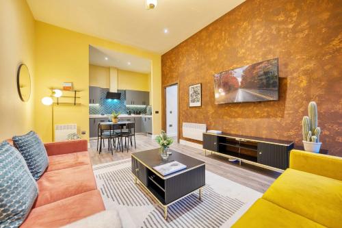 a living room with a couch and a table at Large Central Station 2 Bed Apartment A2 in Glasgow