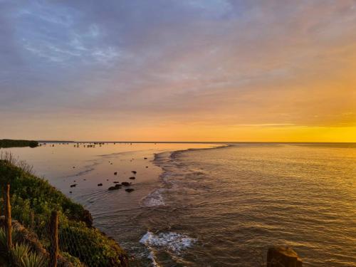 a view of a body of water at sunset at Colobus Suite of 40m2 in Villa 560 m2, View of the Indian Ocean in Shimoni