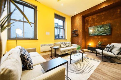 a living room with a couch and a table at Stunning Central Station 2 Bed Apartment B4 in Glasgow