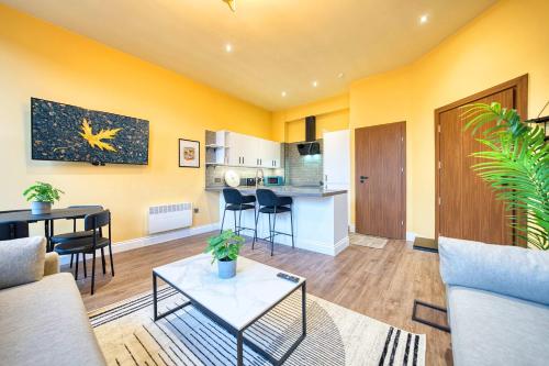 a living room with a couch and a table at Lovely Central Station 1 Bed Apartment A6 in Glasgow