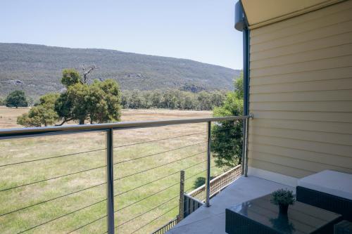 a balcony with a view of a field at Halls Gap Escape Townhouses in Halls Gap