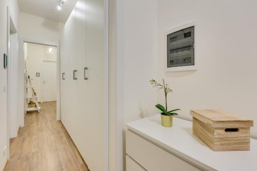 a kitchen with white walls and a white counter top at Rooms Vidar Train Station in Marghera