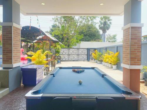 a pool table in the middle of a patio at Hotel Royale in Jomtien Beach